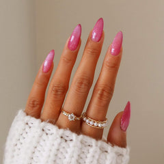 KKUUOO pink almond press-on nails with glitter for quick, stylish manicures.