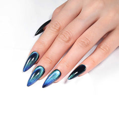 KKUUOO Stiletto nails in Deep Space Blue with cat eye design for dramatic nail art.