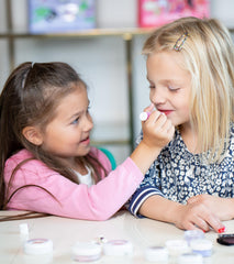 Klee Naturals Pink Lemonade lip shimmer, tinted gloss for kid-safe shine.
