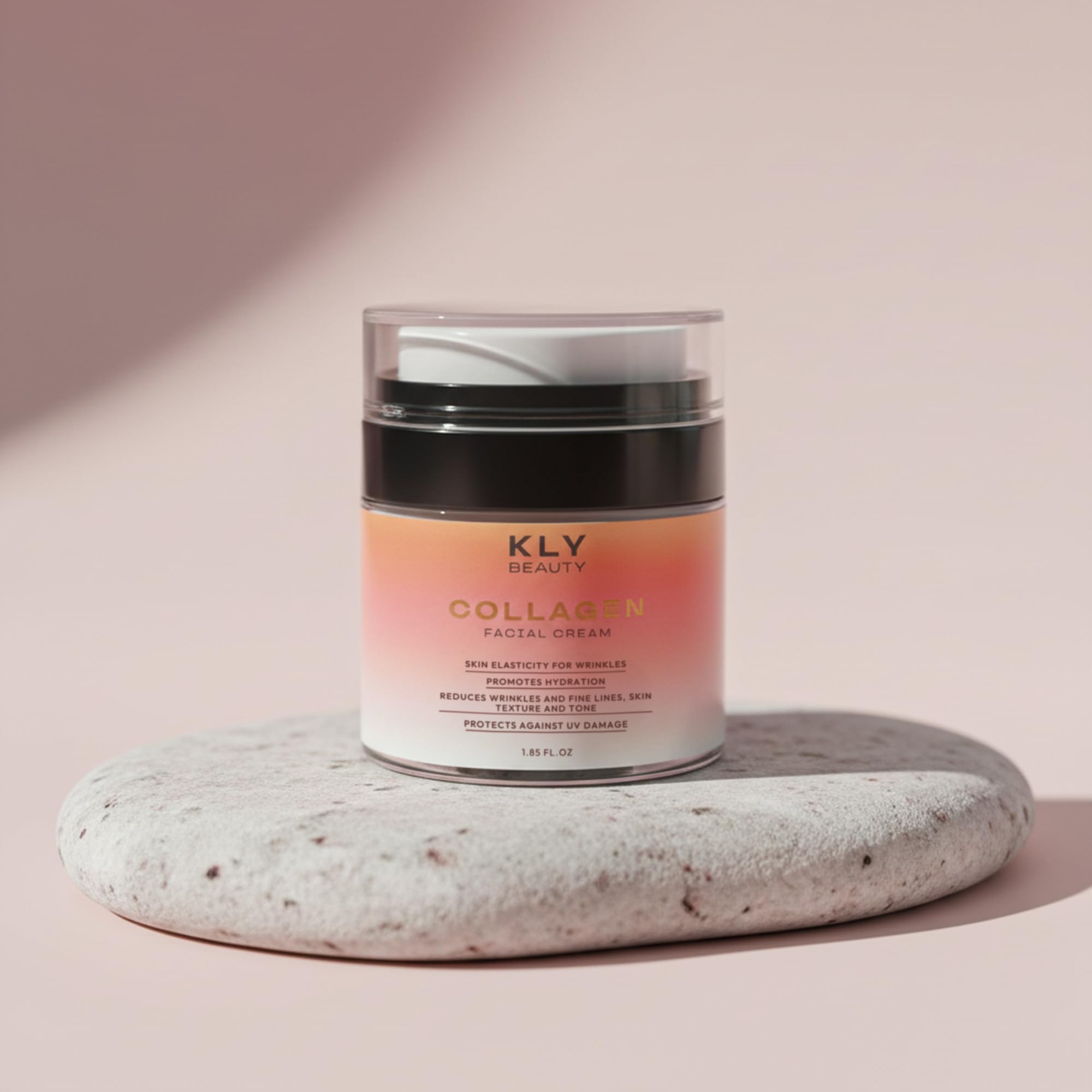 Retinol Collagen Creme tube positioned beside the massager