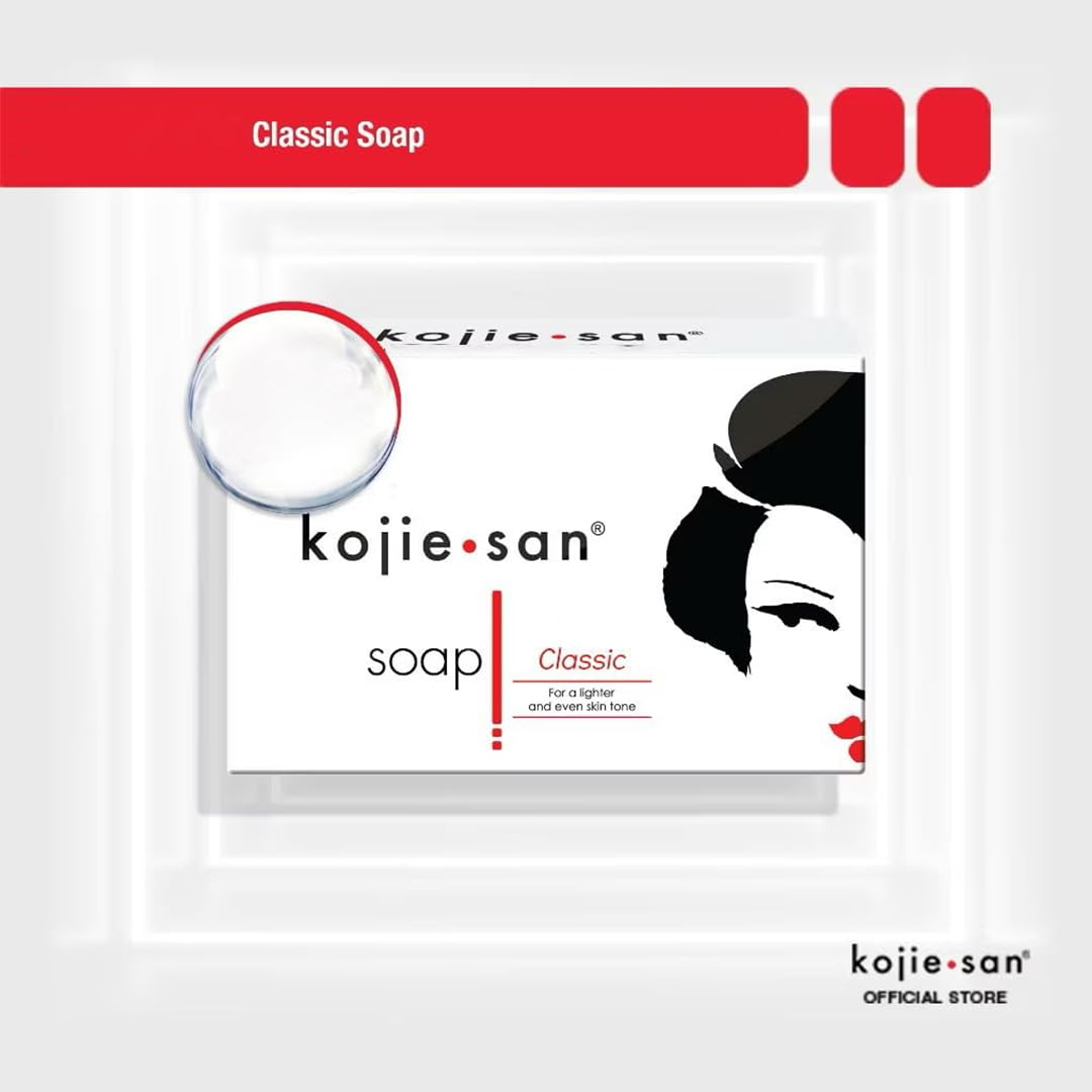Kojie San orange soap beside towel in a simple bathroom setup.