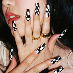 KOLONAMS 24-piece coffin nails in long black and white checkerboard for bold at-home manicures.