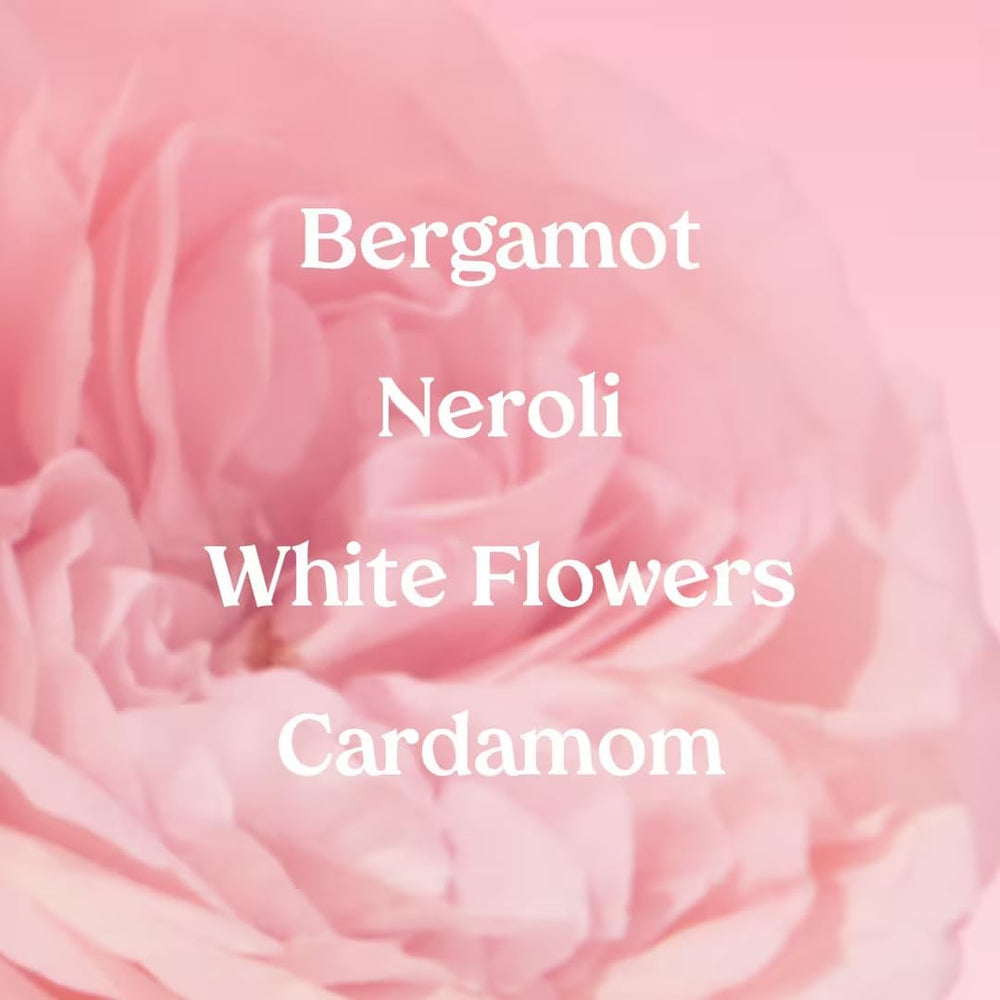 Kopari Marbella Bloom spray in air shows a light floral mist for day wear.