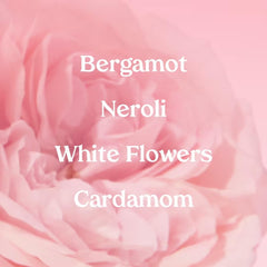 Kopari Marbella Bloom spray in air shows a light floral mist for day wear.