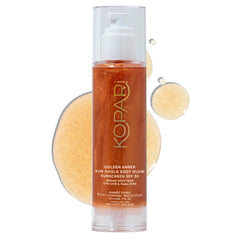 Kopari Sun Shield Body Glow bottle front showing the golden shimmer for radiant skin