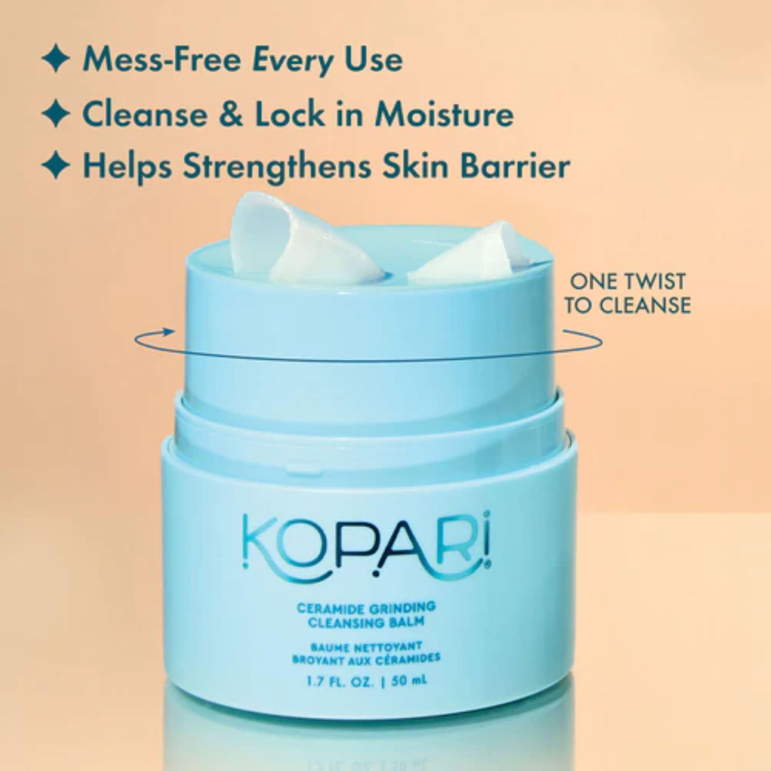 Kopari twist-up grinder in use dispensing fresh cleansing ribbons for easy makeup removal.