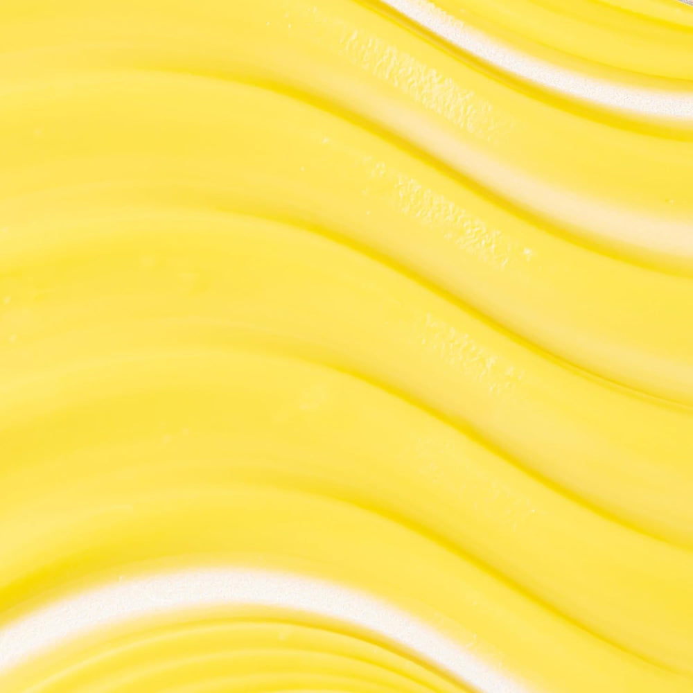 Cream texture close-up of KORA Organics Turmeric Glow moisturizer.