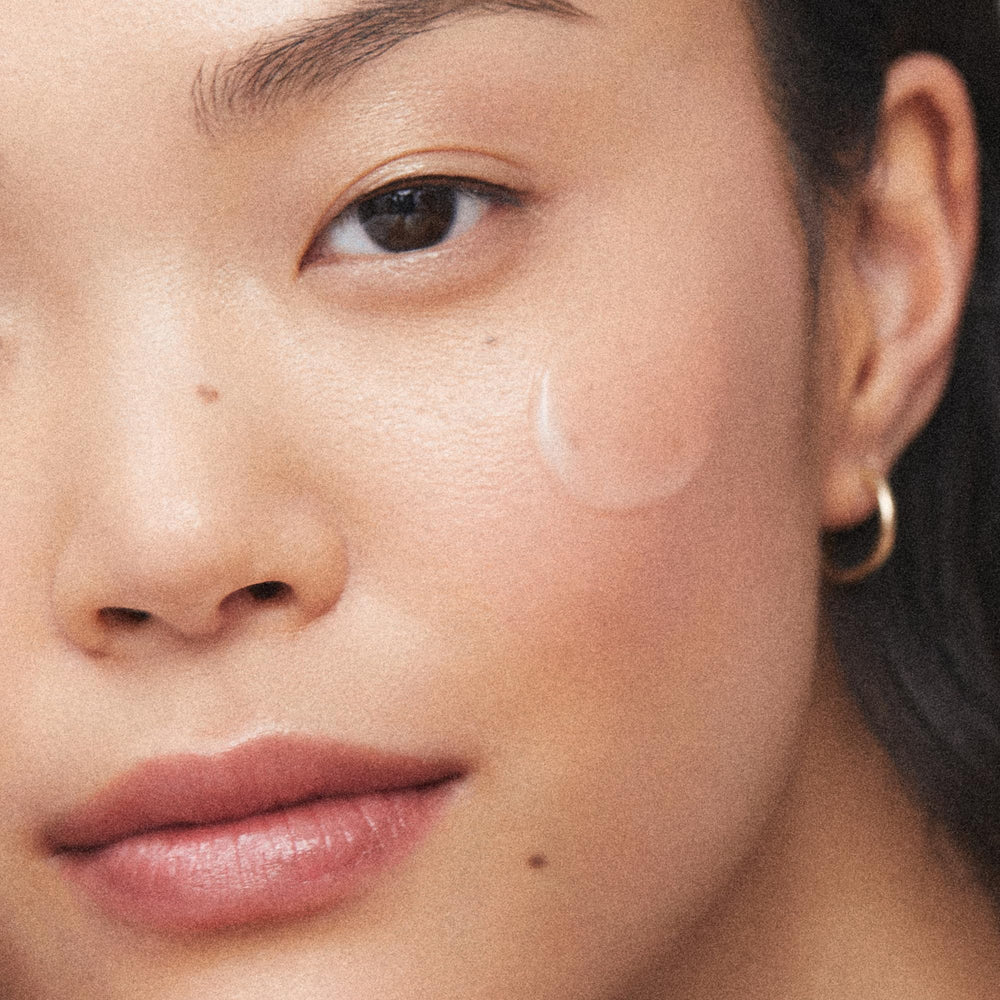 KORA Organics Milky Mushroom Mask applicator showing even, gentle spread.