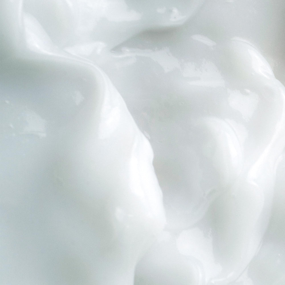 Milky Mushroom mask texture being spread on skin for easy absorption