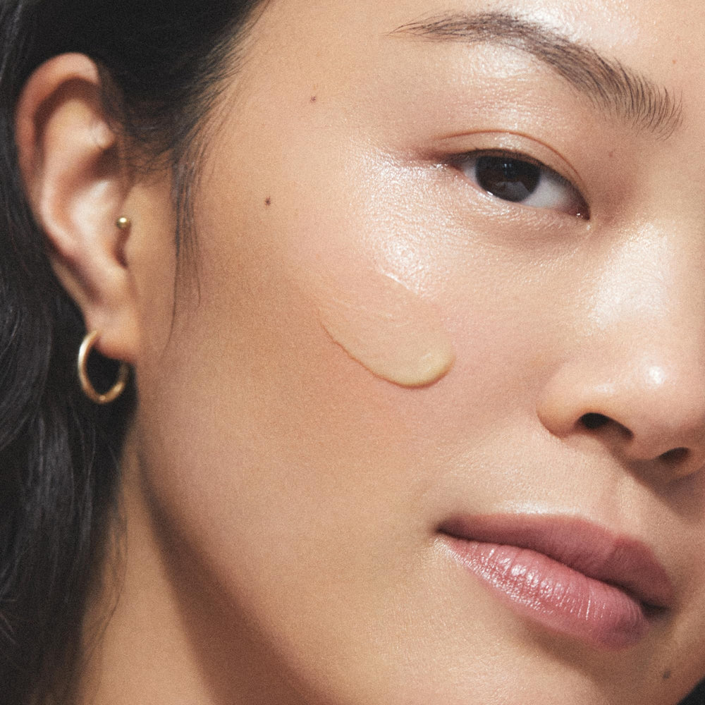 KORA Organics Noni Night AHA Serum on clean skin during night routine