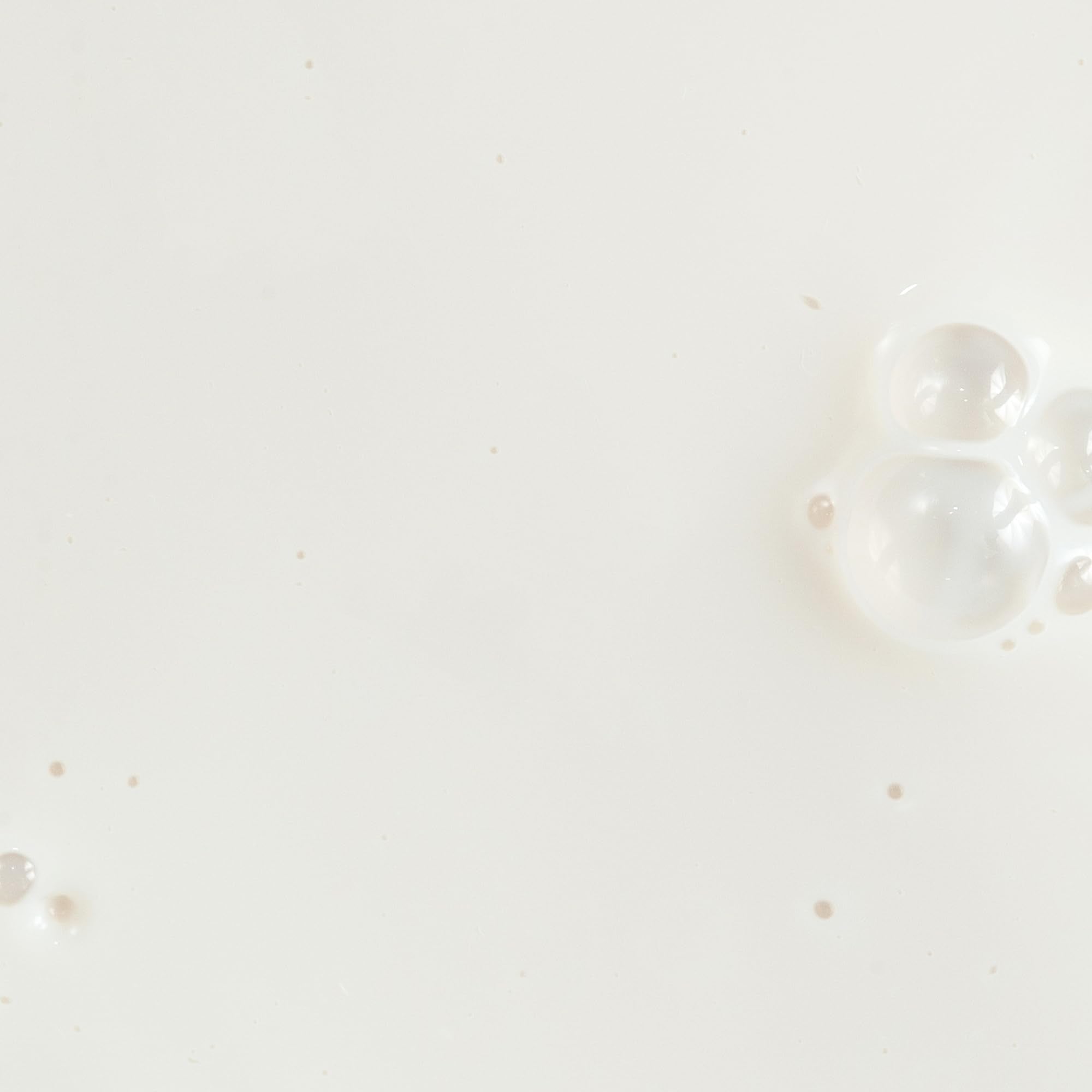 Close-up of Silky Sun Drops texture highlighting a weightless sunscreen feel