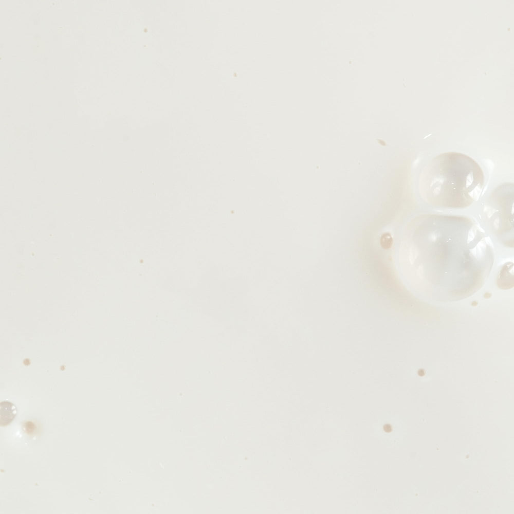 Close-up of Silky Sun Drops texture highlighting a weightless sunscreen feel