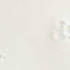 Close-up of Silky Sun Drops texture highlighting a weightless sunscreen feel