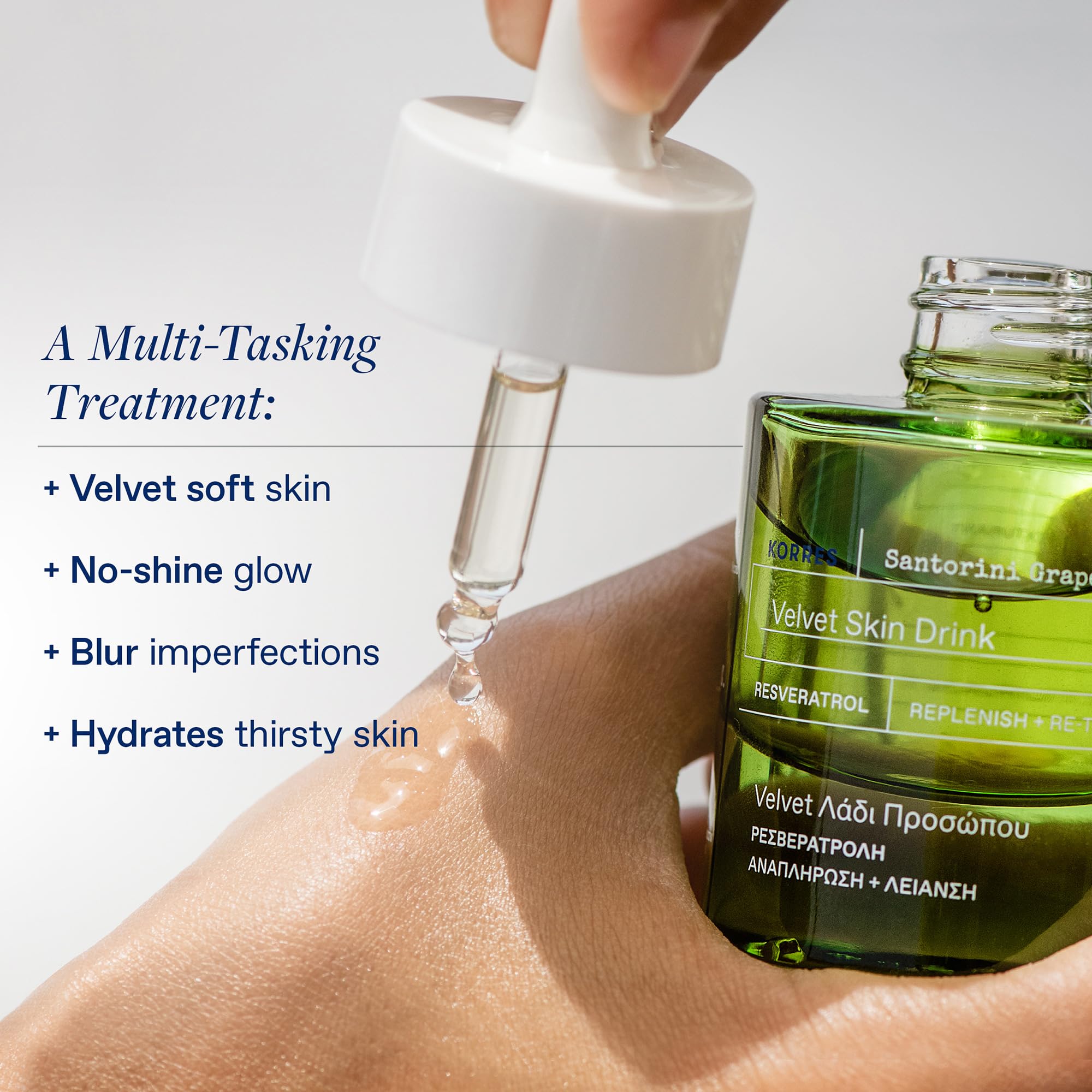 Korres Velvet Skin Drink dropper delivering a lightweight serum on skin.