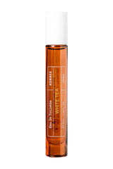 KORRES White Tea EDT bottle on a sunlit surface, offering fresh daytime appeal.