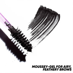 Close-up of Kosas Air Brow spoolie applying gel for feathery, lifted brows.