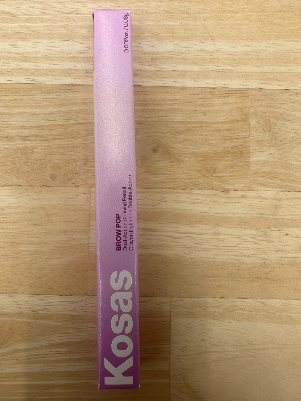 Kosas Brow Pop soft natural color swatch shows medium chocolate brown.