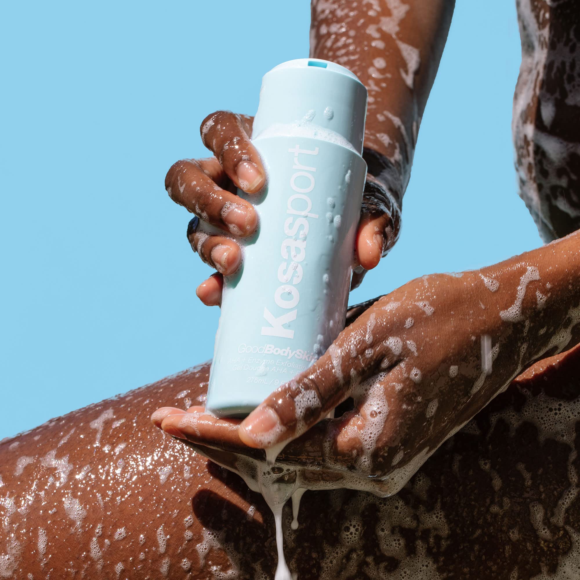 Kosas Kosasport Good Body Skin wash pump application demonstrating easy one-handed use.