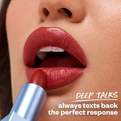 Kosas Weightless Lip Color swatch on lips reveals satin shine and smoothness.