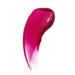 Kosas Wet Lip Oil Gloss swatch on lip with sheer, vinyl-like finish.