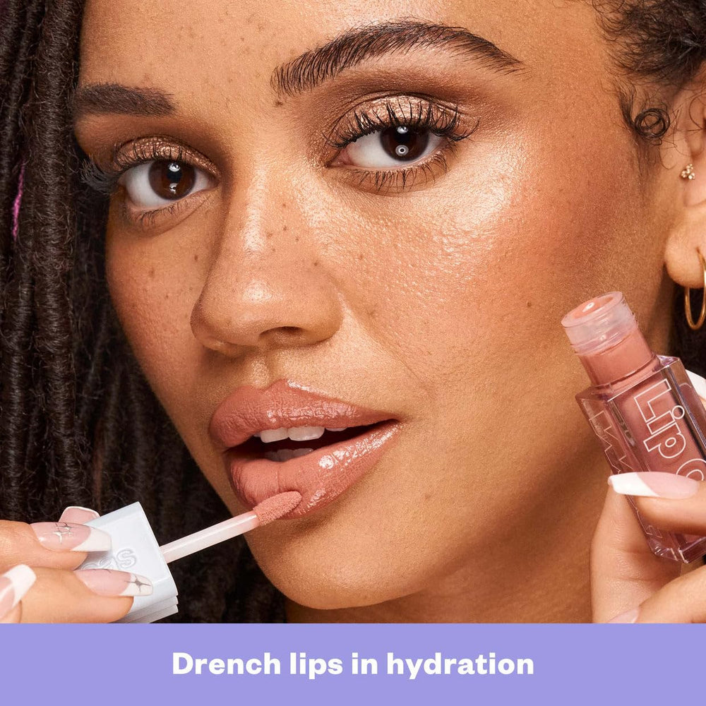Kosas Wet Lip Oil Gloss tube application shows smooth glide.