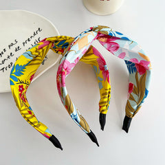KOVOLITU cross knot headband satin finish for stylish, comfortable hold.