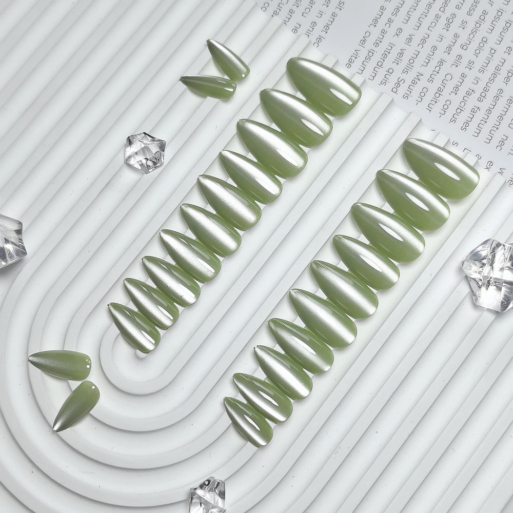 KQueenest Cat Eye Sage Green nails on-hand display highlighting almond shape and bling.