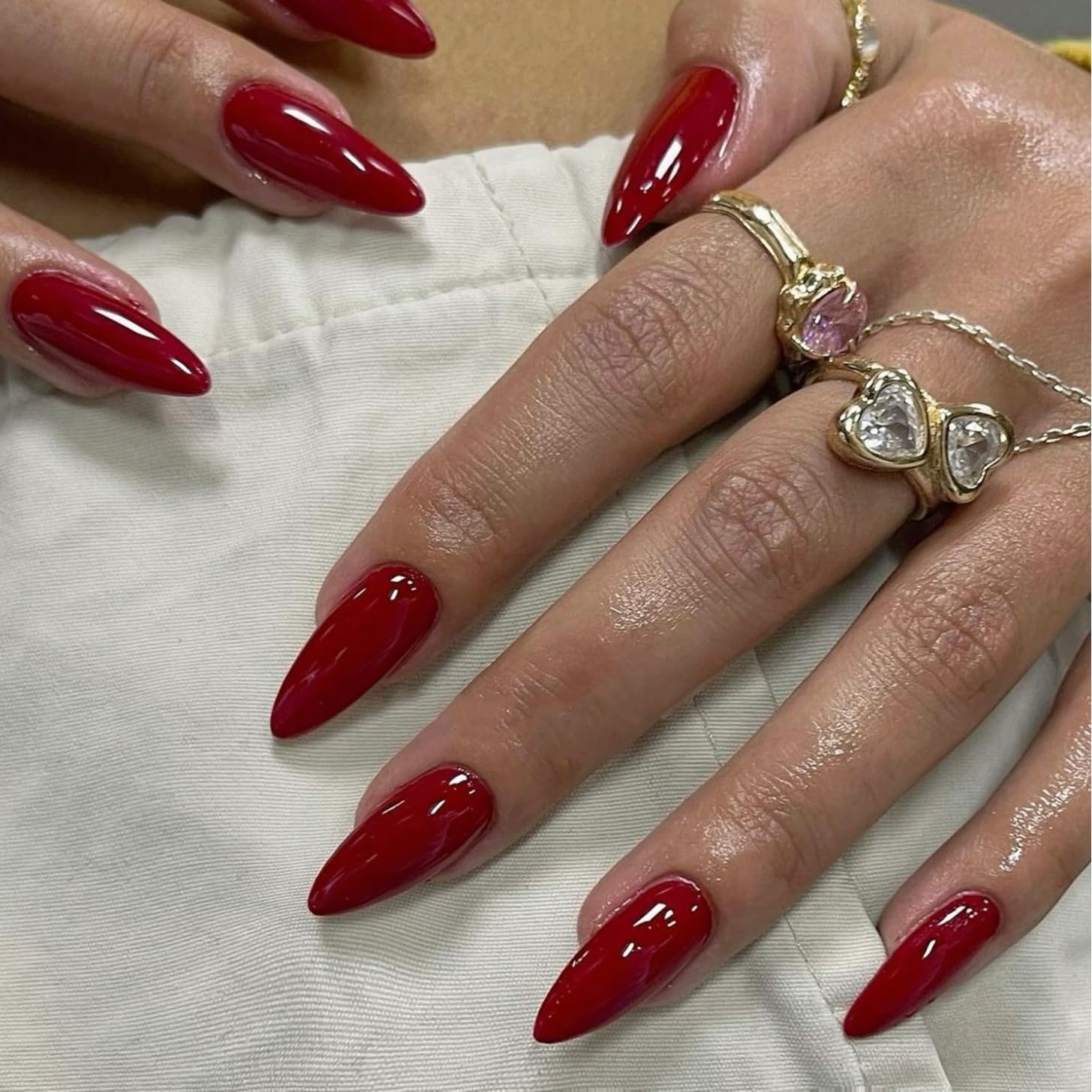 Brand KQueenest cherry red press-on nails with almond medium stiletto shape and durable glossy finish