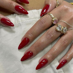 Brand KQueenest cherry red press-on nails with almond medium stiletto shape and durable glossy finish