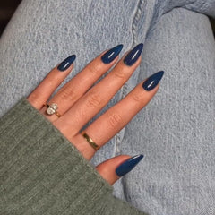KQueenest Deep Blue press-on nails in glossy almond shape for quick at-home manicure.