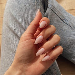 KQueenest almond shaped nails close up highlighting smooth surface finish.