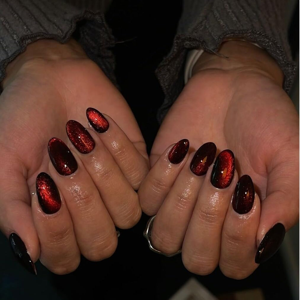 KQueenest glitter burgundy nails shine closeup highlighting rich sparkle.