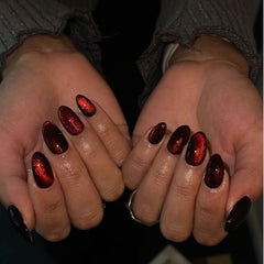KQueenest glitter burgundy nails shine closeup highlighting rich sparkle.