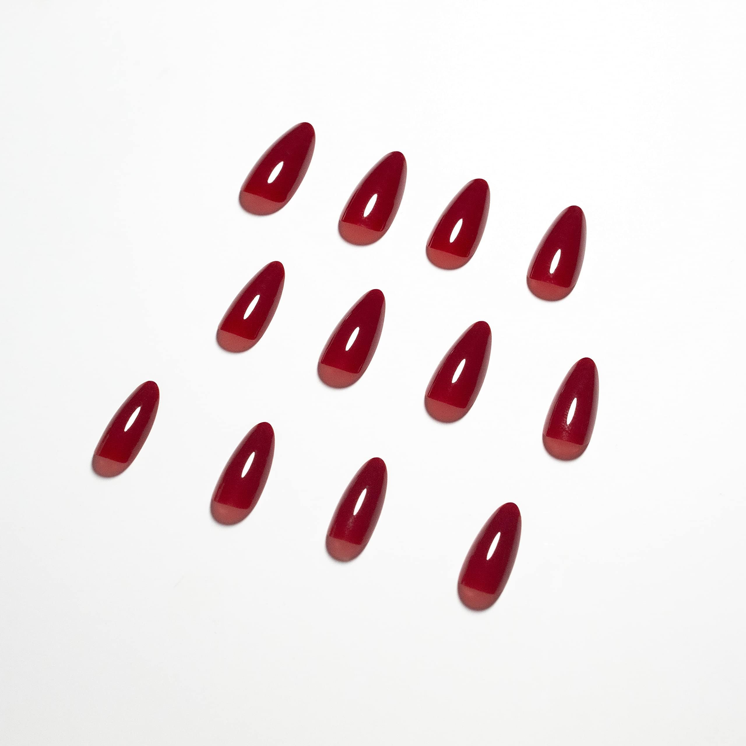 KQueenest glue-on nails during application showing quick, secure fit.