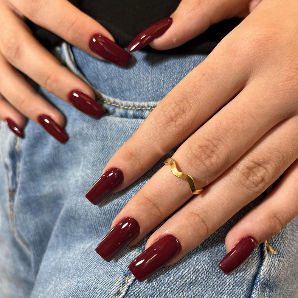 KQueenest long square nails on finger for elegant everyday styling.