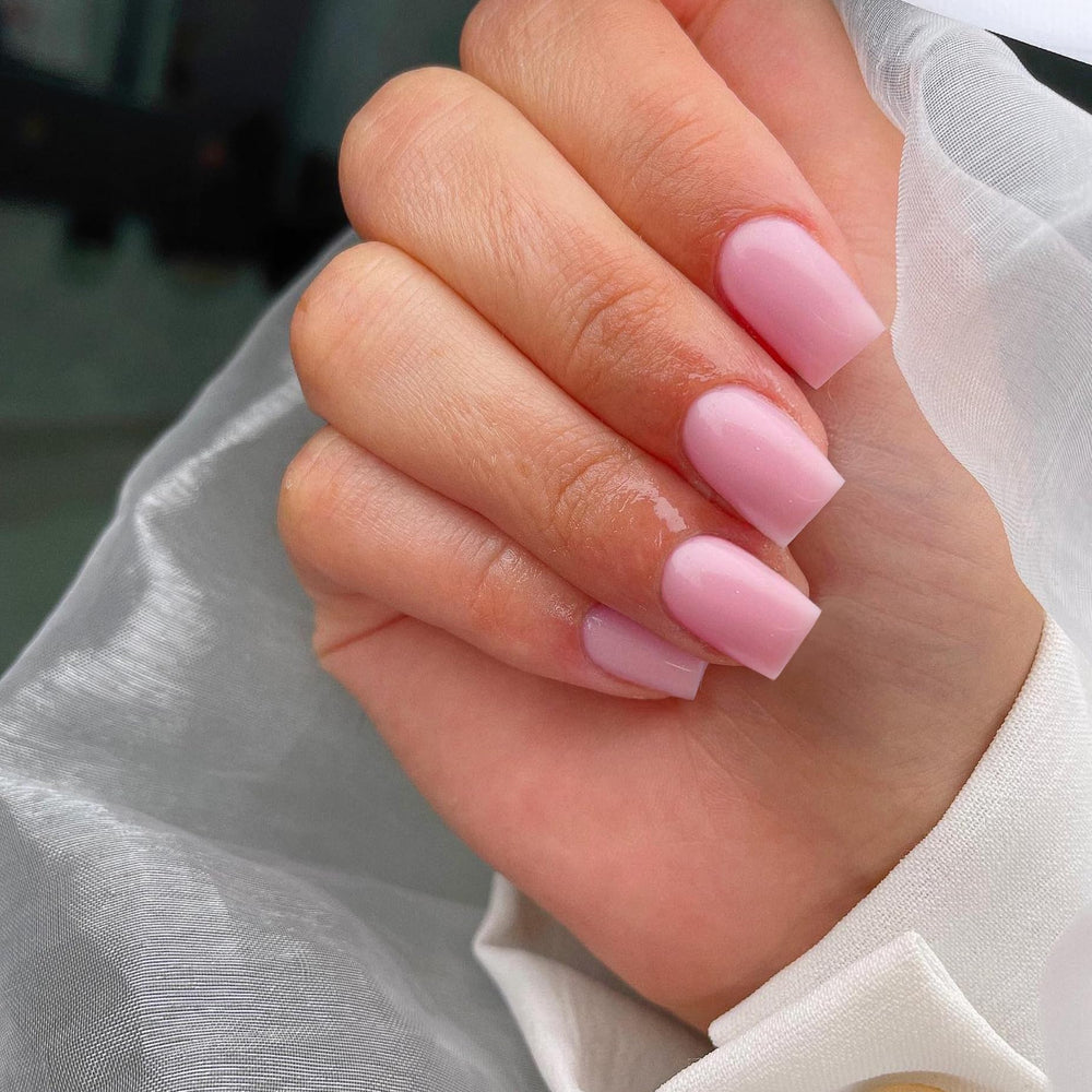 KQueenest pink square medium nails offer a gel-like finish for a polished look.