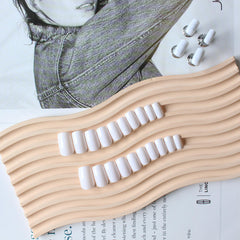 KQueenest real acrylic texture finish nails offer durable wear and glossy look.