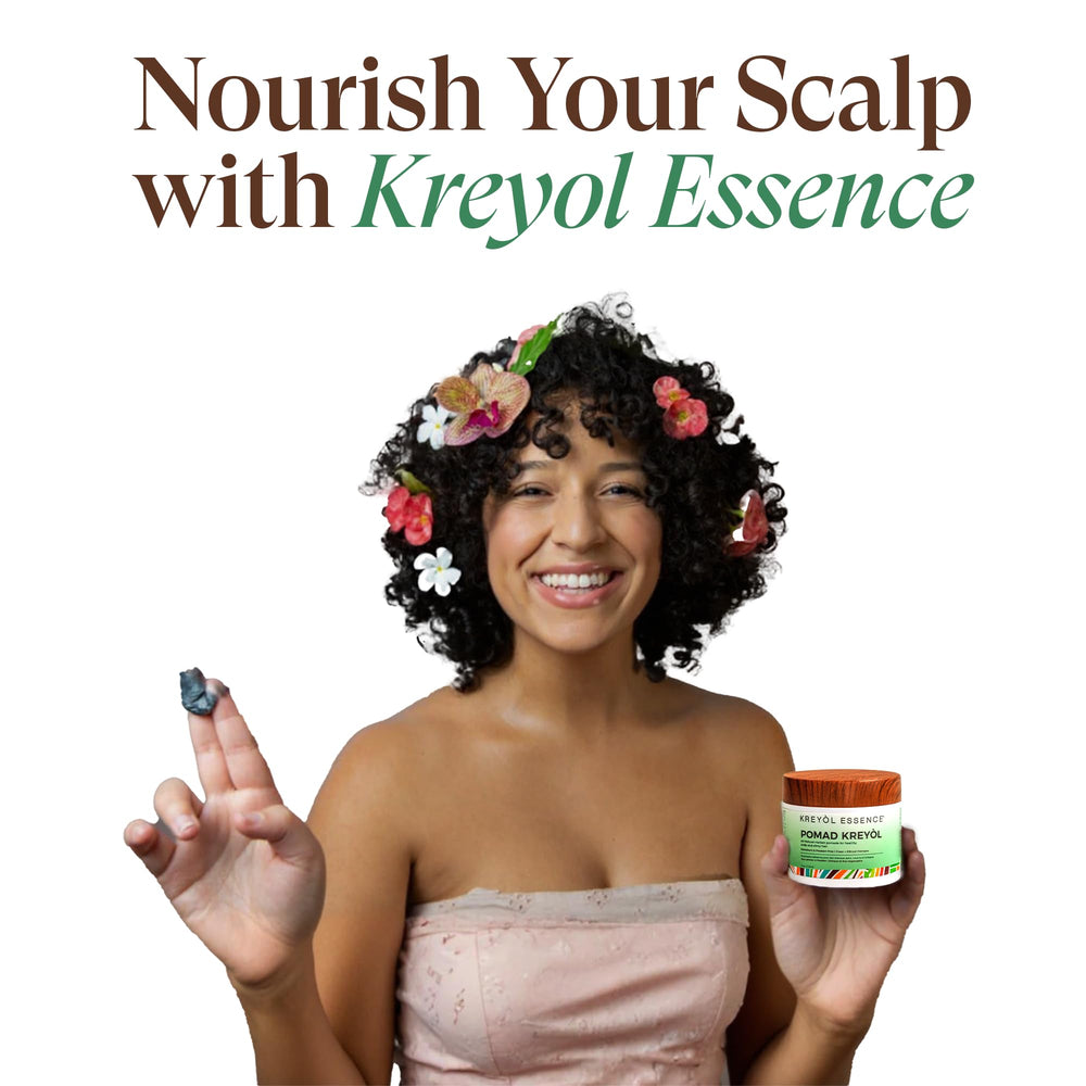 Kreyol Essence Pomad being applied with fingertips for scalp care routine.