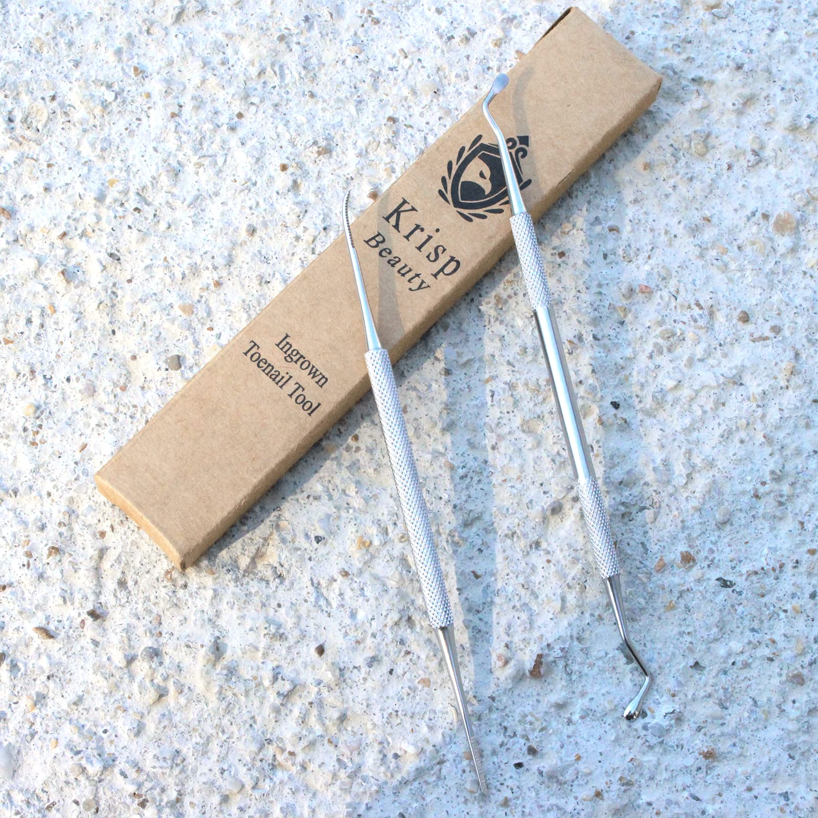 Krisp Beauty nail debris removal scoop demonstrates efficient under-nail cleaning.