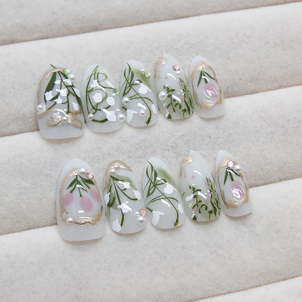 KRTBKR Gold French tips accent nails for a chic, versatile finish.