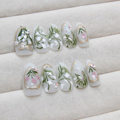 KRTBKR Gold French tips accent nails for a chic, versatile finish.