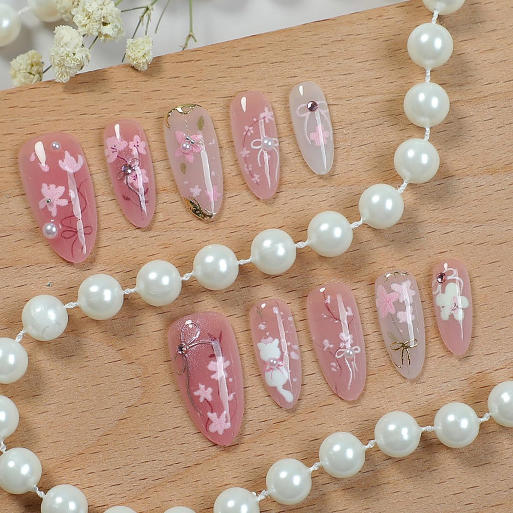 KRTBKR peach blossom nails with 3D rhinestones add festive sparkle