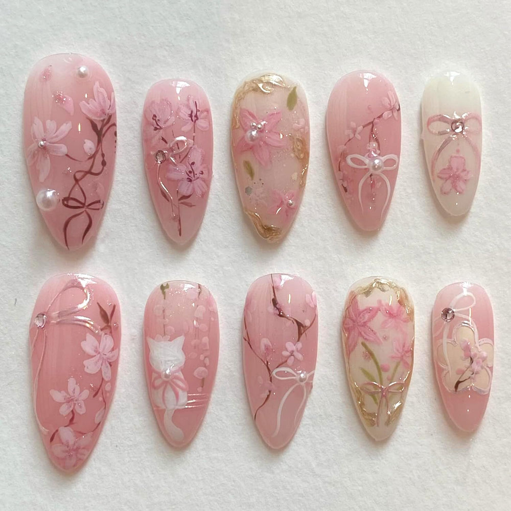 KRTBKR pink flower press-on nails in medium almond shape for quick manicure