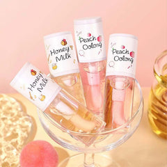 KTouler White Peach Oolong lip oil bottle showing vibrant shine and nourishment