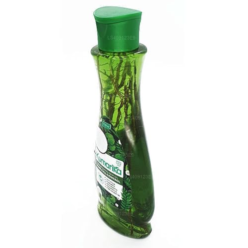 Applying Kumarika Hair Oil with scalp massage for quick absorption
