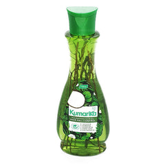 Kumarika Hair Oil bottle close-up showing herbal formula for nourished roots