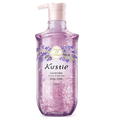 Kustie Lavender Petal Body Wash bottle pours with visible petals for an oil-balancing cleanse.