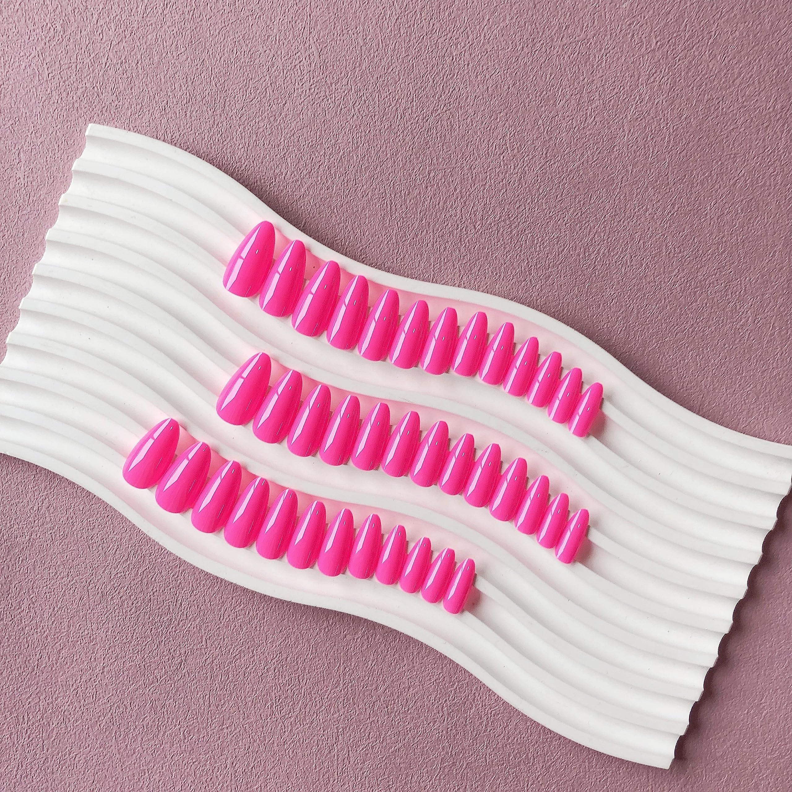 KXAMELIE adhesive-tab nails being applied for quick, mess-free wear