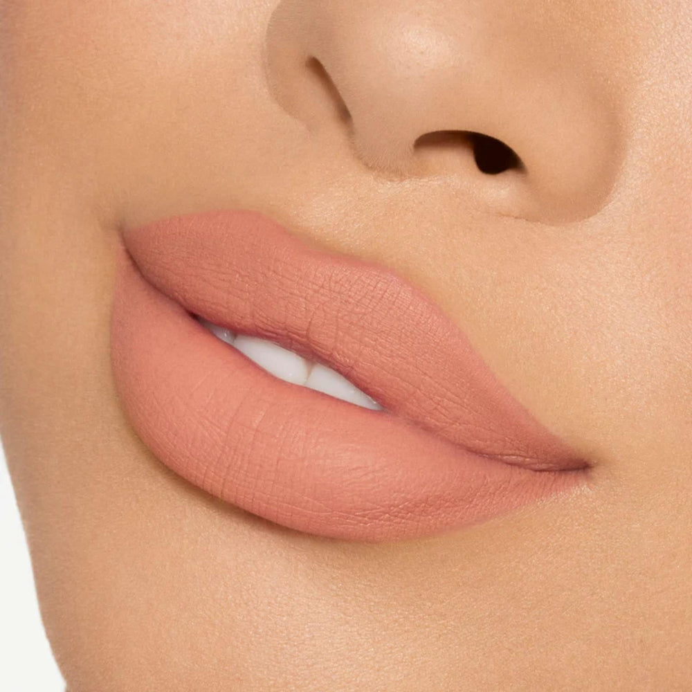 Lips swatch of 820 shade showing warm peachy nude for everyday wear.