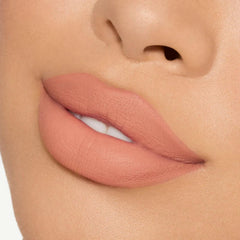 Lips swatch of 820 shade showing warm peachy nude for everyday wear.